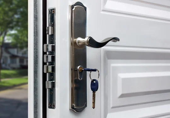A closeup of a door lock and deadbolt