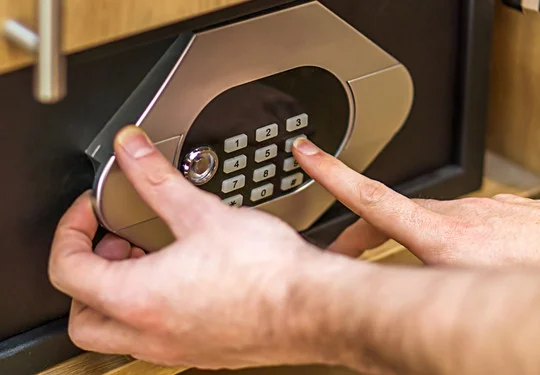 Someone enters the combination on a keypad on a safe